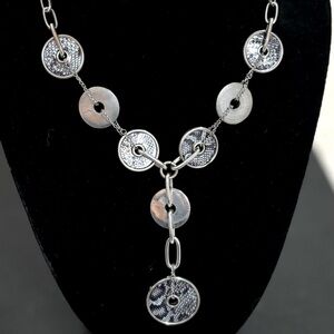 You Spin Me ‘Round silver-tone circle necklace